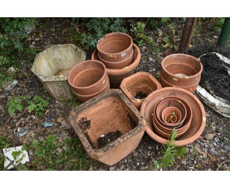A VARIETY OF TERRACOTTA GARDEN PLANTERS, of different shapes and sizes, and a composite octagonal planter (condition - weathe