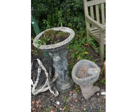 A COMPOSITE PLANTER, the circular top above a plinth depicting three children, diameter 47cm x height 80cm, along with a bird