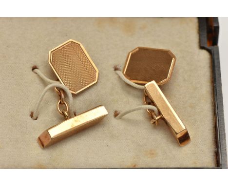 A PAIR OF 9CT GOLD CUFFLINKS, yellow gold rectangular cufflinks, engine turned pattern with cut off corners, chain and toggle