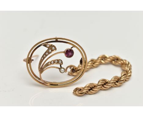 A YELLOW METAL GARNET AND SPLIT PEARL BROOCH, of an oval open work form, flower set with a circular cut garnet and split pear