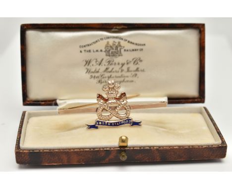 A BOXED YELLOW METAL ENAMEL 'NORTH STAFFORDSHIRE' REGIMENT BROOCH, red and blue enamel Staffordshire knot and Prince of Wales