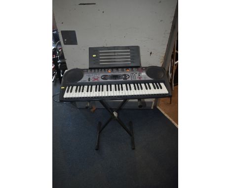 A CASIO LK-35 KEYBOARD AND STAND with power supply (PAT pass and working)