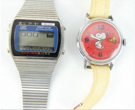 1960s Snoopy watch and a 1970s Zetron Melody digital watch. The Snoopy watch has a Timex case, moving arms and Woodstock seco