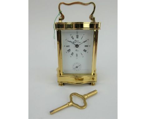 Brand new old stock Rapport French brass cased 8 day carriage clock with alarm. Boxed with paperwork and key. Height 15.5cm.
