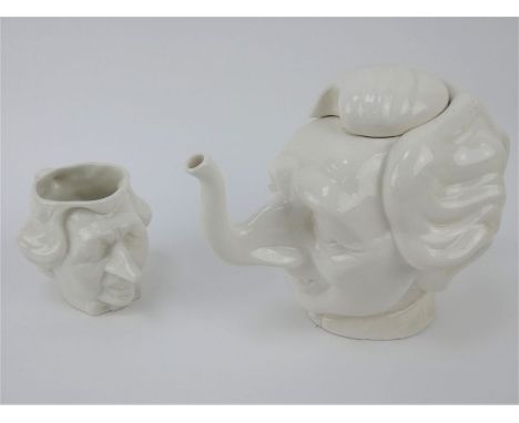 A ceramic 1980s Luck &amp; Flaw Spitting Image Margaret Thatcher caricature teapot and mug. Slight chip to base of teapot.