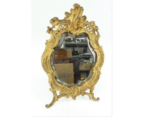 19th century French gilt bronze table mirror of acanthus leaf form and with original bevelled glass. Marked JM to reverse. He