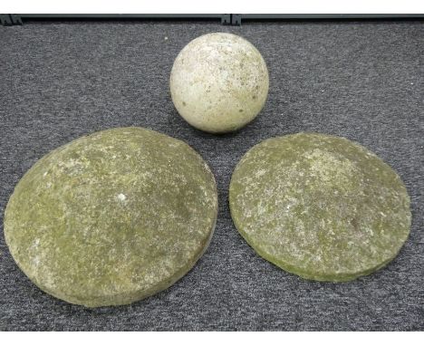 Two antique Kentish ragstone staddle stone caps and an architectural concrete ball. Well weathered. Caps 45cm &amp; 48cm diam