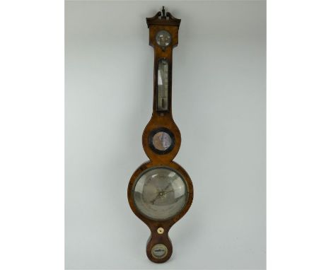 A 19th century mahogany wheel barometer with silvered dials and thermometer. Height 97cm.