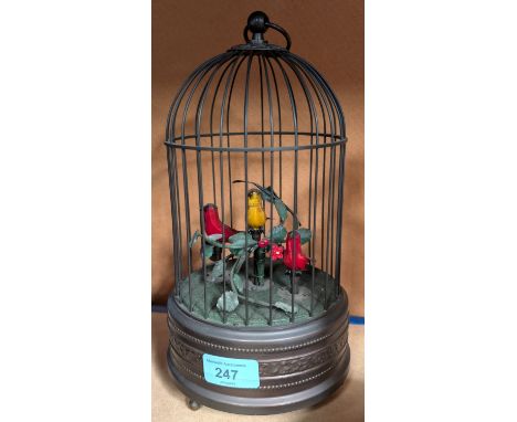 A reproduction windup automaton of three birds in cage.247 - Winds satisfactorily and all three birds in good voice. WE TAKE 