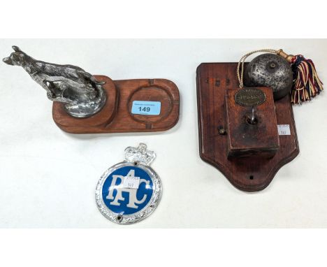 A chrome Alsatian car mascot ashtray, an RAC badge and an antique door bell.