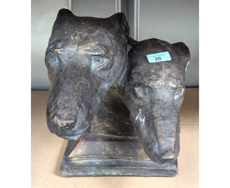 A bronze stoneware sculpture of two greyhound heads, 40cm length
