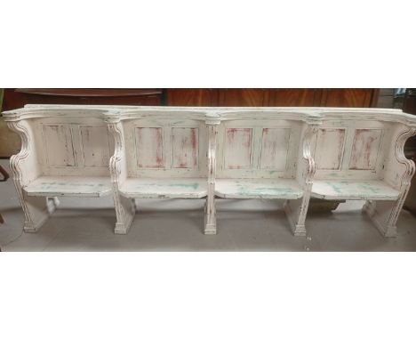 A vintage painted pine theatre/cinema pew.