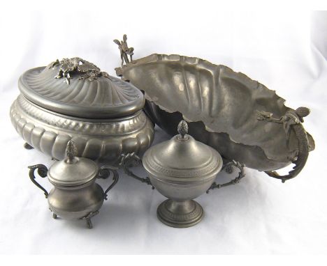 Pewter and white metal. A covered oval tureen, 18x28cm. , a long centrepiece, the handles dragons, 18x47cm. , and two two han