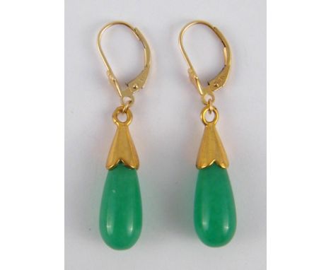 A pair of jade drop earrings with yellow metal fittings, (marked 9K), gilt metal caps, approx 4cm drop, 4.8 gms.
