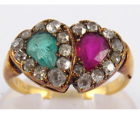 An antique ruby, emerald and diamond ring, designed as entwined hearts, emerald approx 6 x 4.3mm, ring size K, 3.7 gms.
