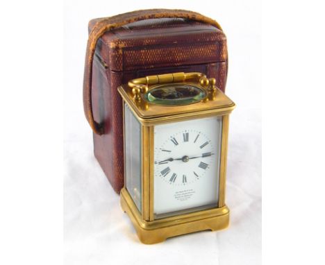 A brass carriage clock by Le Roy et fils, Bond st. and Palais Royal, Paris, with white enamel dial  in original leather trave