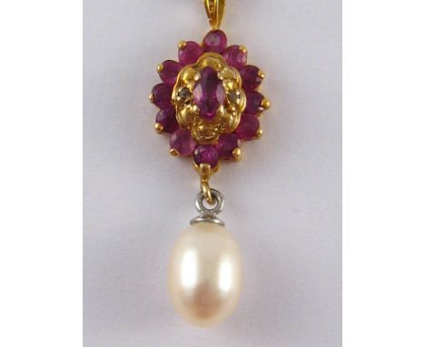 A 9 carat gold ruby and freshwater pearl pendant and chain, pendant approx 3cm,3.5 gms.