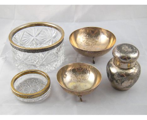 Two continental silver bowls, each on three feet and stamped 800, wt. 185gm., together with a silver plated tea caddy and two