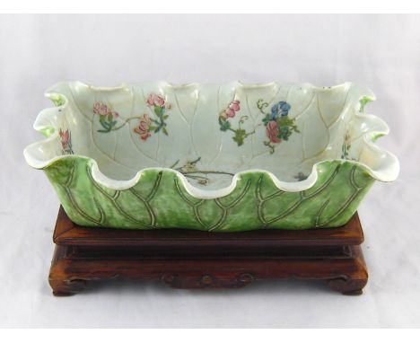 A Chinese ceramic rectangular water bowl or jardinaire  moulded as a lotus leaf with veins and shaped rim , the interior with