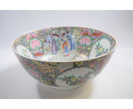 Large Japanese porcelain punch bowl, 20th Century with polychrome designs of flowers and Chinese characters, 35cm diameter