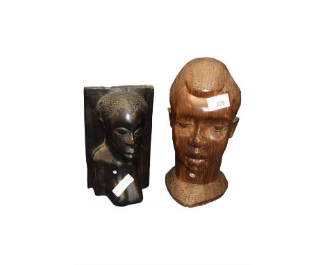 Two carved African busts, one in a black ebony wood the other in a light oak, largest 28cm