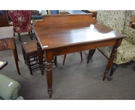 19th Century mahogany console table of rectangular form raised on turned and fluted legs, 107cm wide