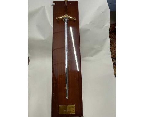 Large Wilkinson commemorative sword mounted on a polished hardwood back bearing presentation plaque 'Presented to Alen Dale o