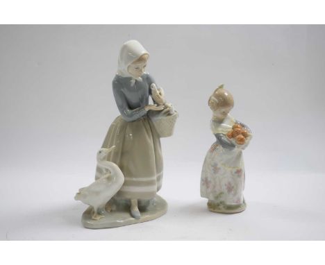 Lladro model of a goose girl together with a smaller model of a orange seller, tallest 22cm high