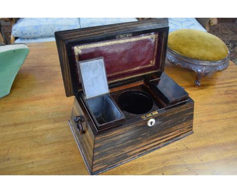 19th Century coromandel veneered tea caddy of sarcophagus form with a fitted hinged interior and ringlet carry handles, 34cm 