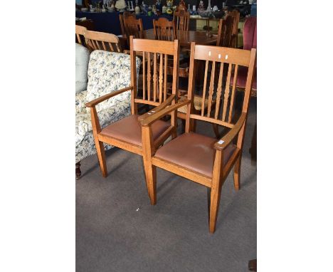 Pair of 20th Century light oak carver chairs with drop in seats