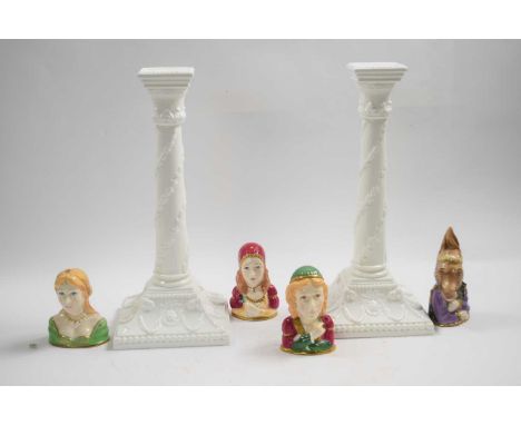 A pair of white glazed Royal Worcester candlesticks in neo-classical style together with four candle snuffers from the Shakes