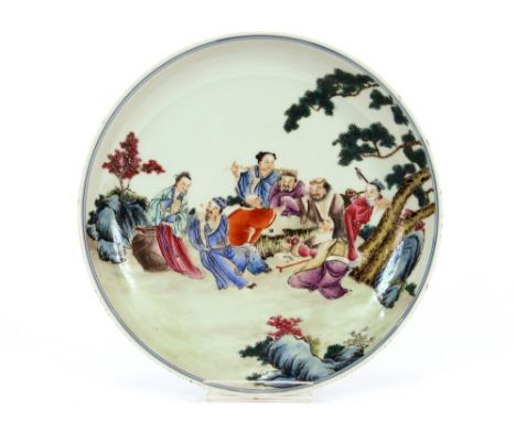 A Chinese&nbsp;famille rose shallow dish,&nbsp;decorated figures in exotic garden setting playing games, seal mark to base, 2