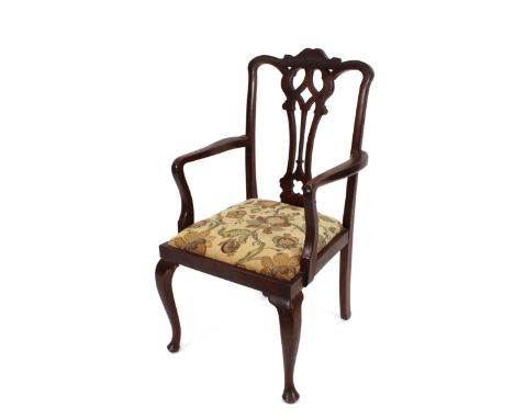 A set of four mahogany 19th Century dining chairs, in the Chippendale style, (3 standards and 1 elbow); and a set of six simi