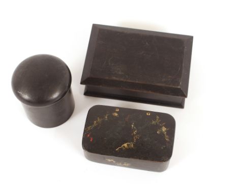 A paper mache snuff box, with painted floral decoration; an ebony hinged trinket box and a circular ebony dressing table tidy