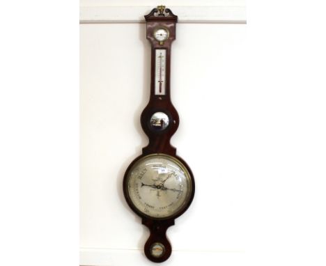 A 19th Century mahogany and boxwood strung wheel barometer, surmounted by a scroll arch pediment and finial above a thermomet