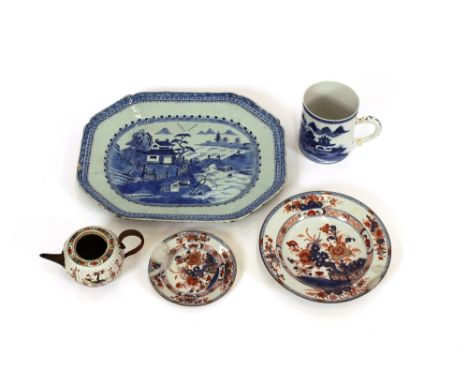 A 19th Century Chinese blue and white platter, decorated with pagoda and river scenes, 42cm; a 19th Century Chinese mug decor