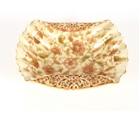 A Zsolnay Pecs bowl, by Fischer, having folded pierced border, floral spray decoration heightened in gilt, 24cm long