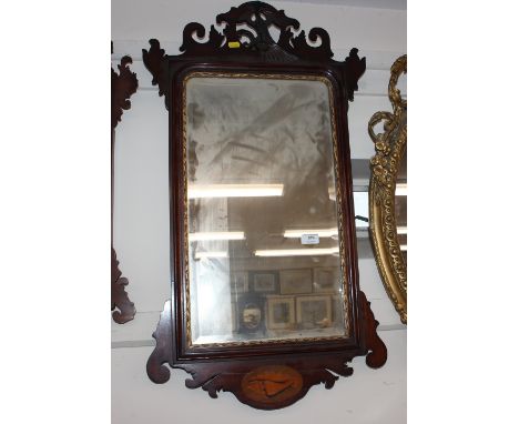 A 19th Century mahogany and satinwood inlaid wall mirror, in the Chippendale manner with fret carved decoration, Ho Ho bird m