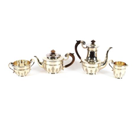 A late Victorian silver four piece tea set, by Walker and Tolhurst Ltd., having reeded band and raised floral decoration, Lon