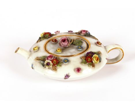 A Meissen teapot, of small size, squat form with floral encrusted decoration, 5cm high