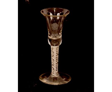 An Antique drinking glass, having twist column stem, bell shaped bowl, raised on a stepped circular spread foot, 15cm high