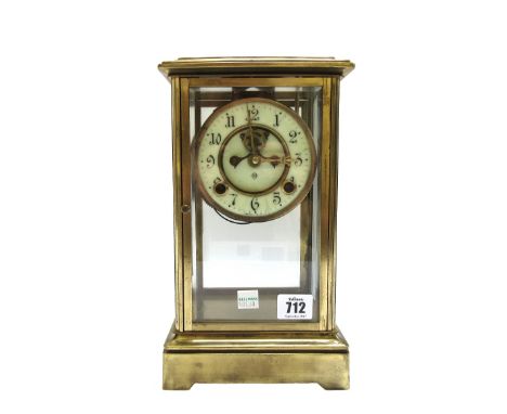 An Ansonia brass four glass mantel clock, with two train movement and hammer striking on a coiled gong, 28.5cm high, (faux me