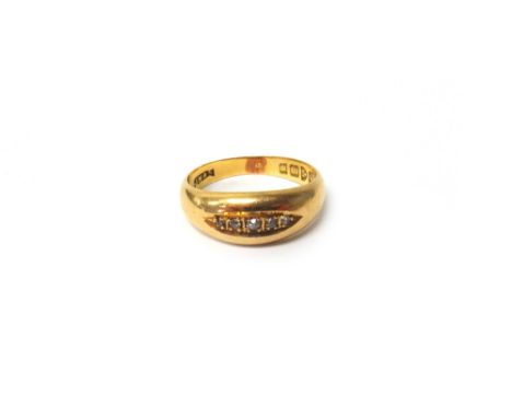An 18ct gold and diamond ring, mounted with a row of five small cushion shaped diamonds, within a boat shaped setting, Cheste