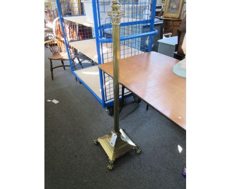 A Victorian brass standard lamp of Corinthian column form, raised on four ball and claw feet, 125cm high, (shade).