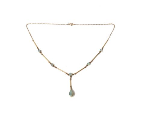 A 9ct gold and opal pendant necklace, the drop collet set with a pear shaped opal, otherwise mounted with five smaller circul