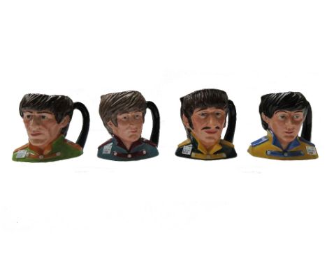 A set of four 'Royal Doulton', The Beatles' character jugs and a Washington pottery 'The Beatles' four piece tea service, com