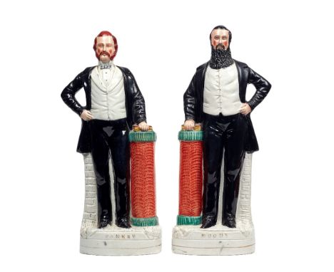 A pair of Staffordshire portrait figures of Sankey and Moody, 19th century, polychrome painted, with one hand on a Bible atop