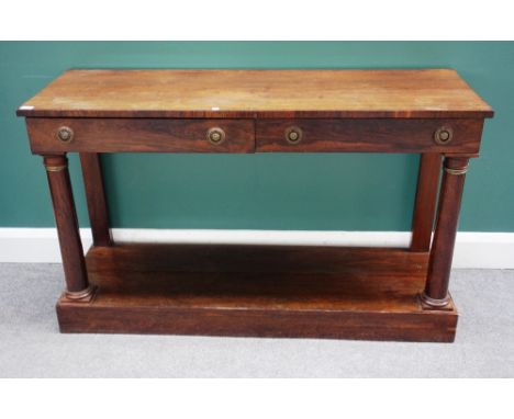 A Regency rosewood console table, the rectangular top with two drawers, on turned supports united by platform undertier, 127c