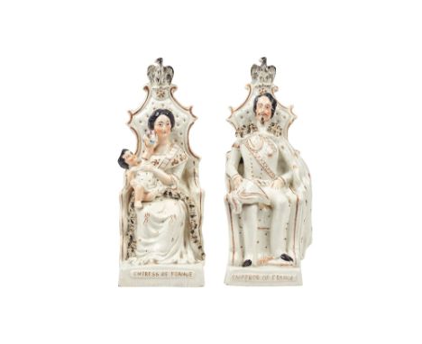 A pair of Staffordshire portrait figures, Emperor and Empress of France, 19th century, gilt over white, each modelled seated 