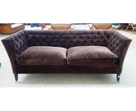 Sofa.com; a chocolate brown button upholstered square back sofa, on tapering ebonised supports, 125cm wide x 92cm high.